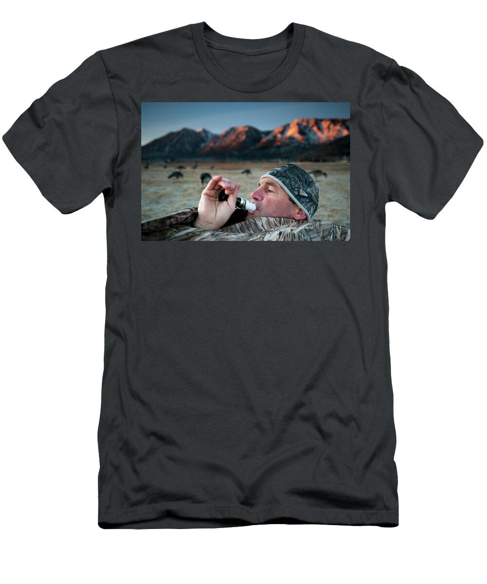 1 a Hunter Uses a Call to Lure Geese Corey Rich T-Shirt