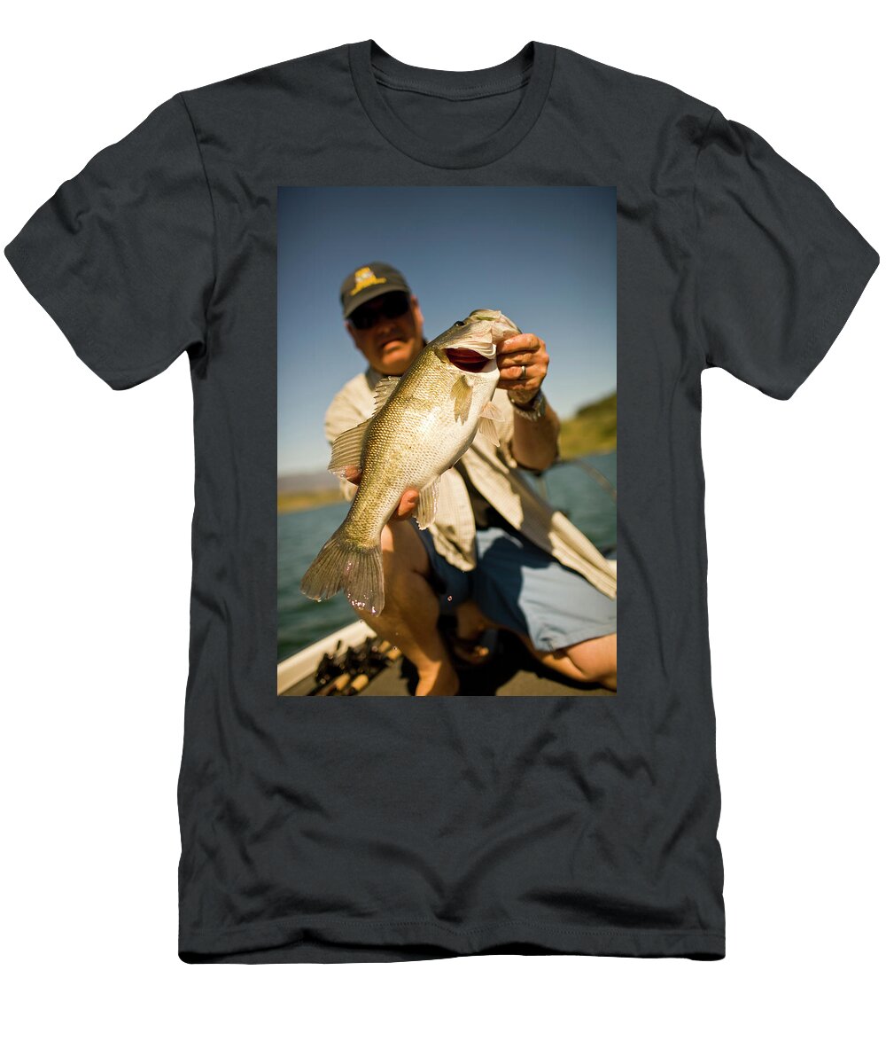 7 a Man Holds Up His Catch Proudly Jay Reilly T-Shirt