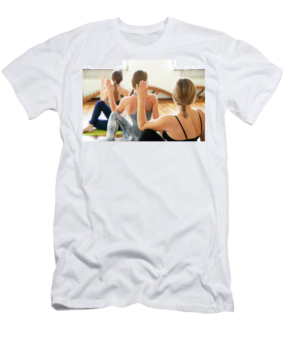 Group of People Doing Yoga Exercise in Class Maria Kray T-Shirt