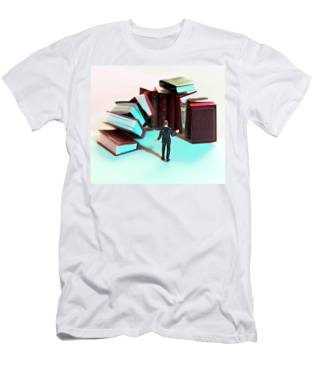 Man Standing in Front of Large Books Csa Images T-Shirt