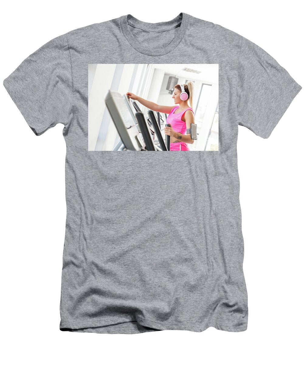 Woman Starting Crosstrainer Workout in a Gym Michal Bednarek T-Shirt