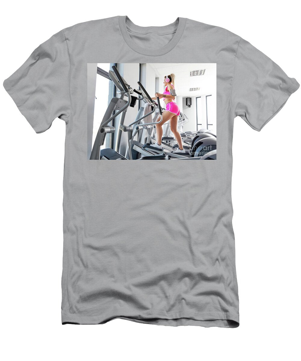 Woman Training At Crosstrainer in a Gym Michal Bednarek T-Shirt