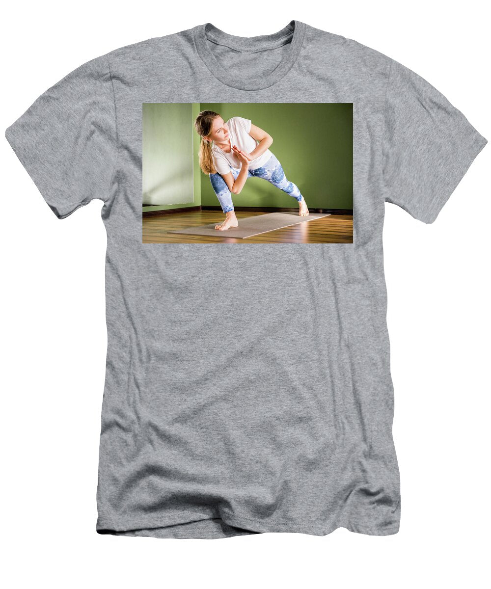 Young Attractive Woman Does Yoga Exercise in the Gym on Mat Maria Kray T-Shirt